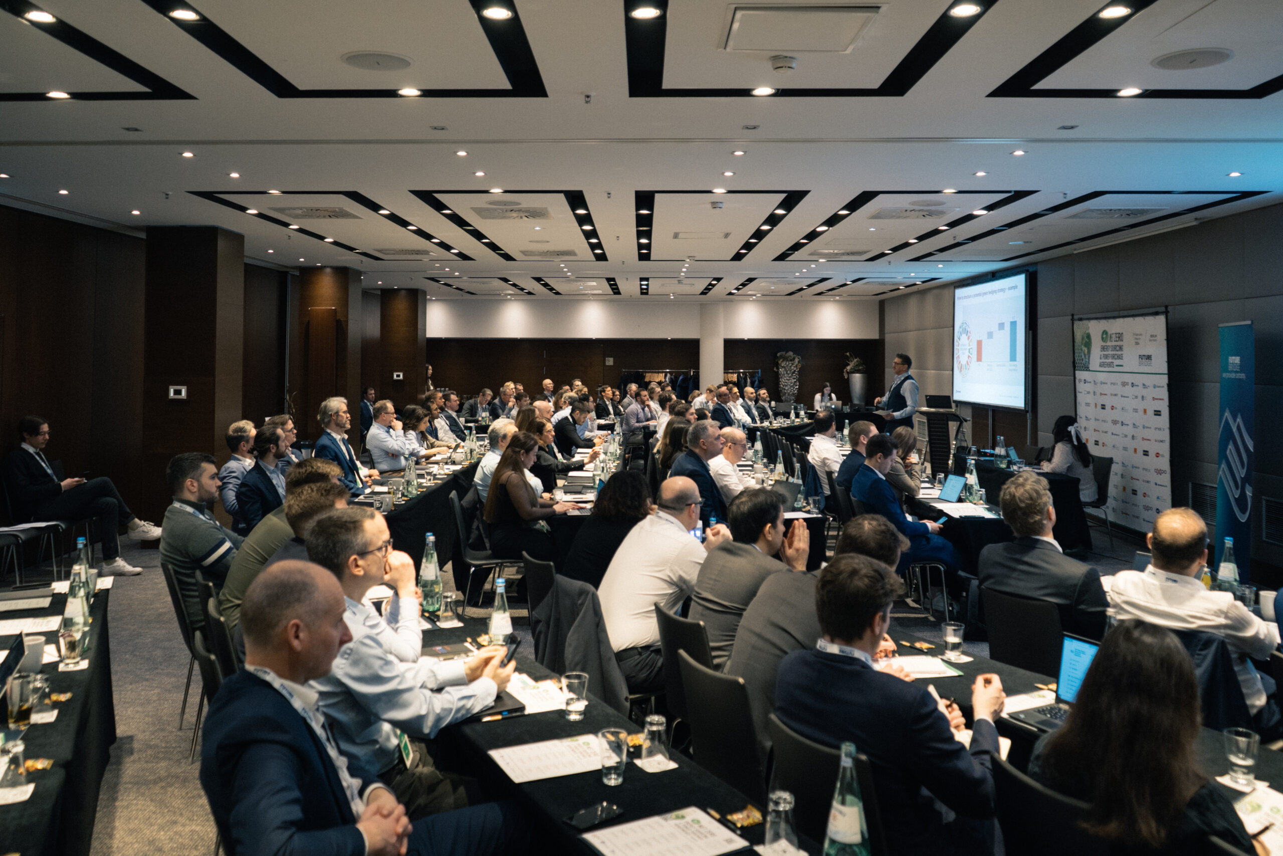 Speaker presenting to a full room