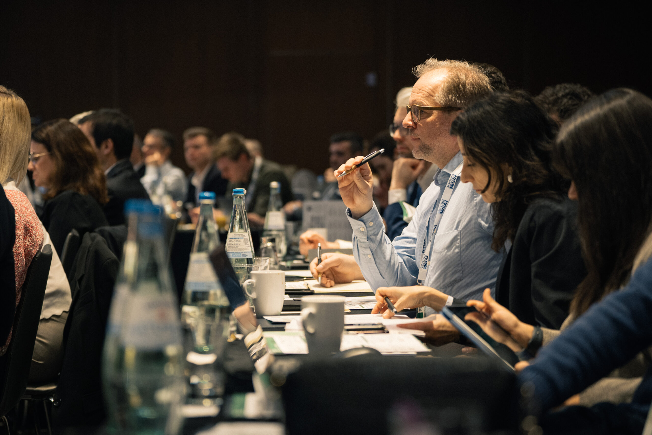 Audience listening during a keynote at a Future Bridge summit